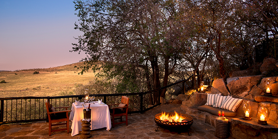 Private dinner alongside personal mini-boma fire at Tshukudu Bush Lodge